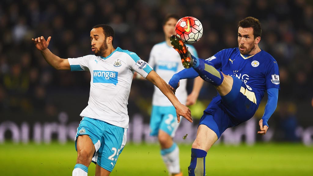 LEICESTER, ENGLAND - MARCH 14:  Christian Fuchs of Leicester City clears the ball from Andros Townsend of Newcastle United during the Barclays Premier League match between Leicester City and Newcastle United at The King Power Stadium on March 14, 2016 in Leicester, England.  (Photo by Laurence Griffiths/Getty Images)
